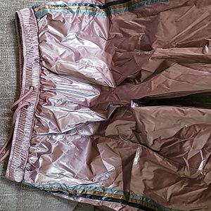 Pants they are brand new, rose color with stripes down the side.